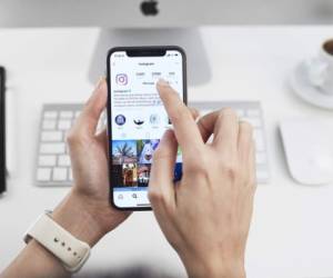 Istanbul, Turkey - December 15, 2018: Person holding a brand new Apple iPhone X with Instagram profile on the screen. Instagram is an online mobile social networking service, launched in October 2010.