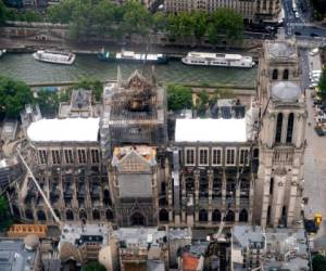 This aerial picture taken on June 12, 2019 in the French capital Paris shows the Notre Dame de Paris cathedral under repair after it was badly damaged by a huge fire on April 15. (Photo by Lionel BONAVENTURE / AFP)