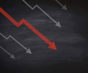 Decline in stocks on blackboard