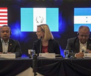 United States Secretary of Homeland Security (DHS) Kirstjen Nielsen (C) Honduran Security Minister Julian Pacheco Tinoco (R) and El Salvador's Security Minister Mauricio Ramirez Landaverde, attend the opening of the fourth meeting of security ministers of the 'Northern Triangle' in San Salvador, on February 20, 2019. - Nielsen called on Guatemala, El Salvador and Honduras security ministers to stop new caravans of migrants who illegally try to reach the US. (Photo by MARVIN RECINOS / AFP)