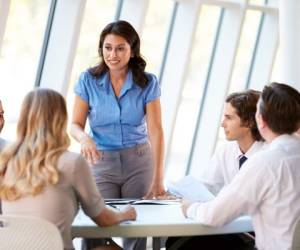 Business People Having Board Meeting In Modern Office