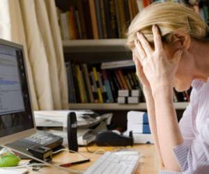 Stressed out woman in home office
