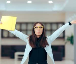 Funny enthusiastic female executive celebrating professional achievement