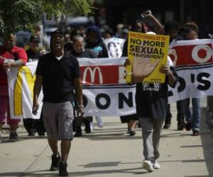 McDonald's employees and other fast food chain workers protest against sexual harassment in the workplace on September 18, 2018 in Chicago, Illinois. McDonald's workers in 10 US cities staged a one-day strike Tuesday inspired by the #MeToo movement, alleging the fast-food giant does not adequately address pervasive sexual harassment at its stores. / AFP PHOTO / Joshua Lott