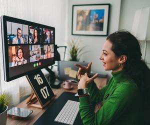 Businesspeople discussing business on virtual staff meeting during pandemic