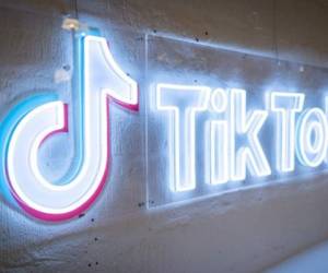 A photograph taken on February 9, 2022 shows the logo of video-focused social networking service TikTok, at the TikTok UK office, in London. - With a billion users, TikTok has rapidly become one of the most important players in the music industry, and now has its sights set on revolutionising the way artists are discovered and get paid. (Photo by Tolga Akmen / AFP)