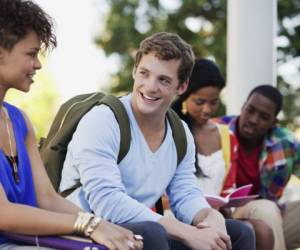 Santa Monica, California, USA --- Smiling students talking outdoors --- Image by © 237/Sam Edwards/Ocean/Corbis