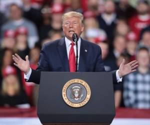 President Donald Trump pumps his fist as he delivers the State of the Union address in the chamber of the US House of Representatives at the US Capitol Building on February 4, 2020 in Washington, DC. (Photo by Olivier DOULIERY / AFP)