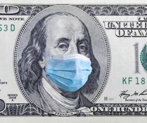 Coronavirus Wuhan. US quarantine, 100 dollar banknote with medical mask. The concept of epidemic and protection against coronavrius.