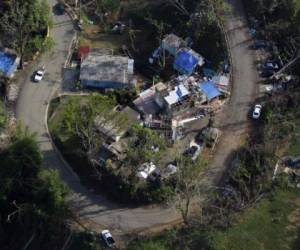 An aerial view of houses affected by the passing of Hurricane Maria in Naranjito, Puerto Rico, October 23, 2017. / AFP PHOTO / Ricardo ARDUENGO