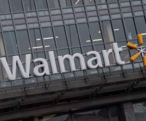 (FILES) In this file photo taken on March 1, 2019 the Walmart logo is seen on a store in Washington, DC. - Retail giant Walmart saw profits surge in the latest quarter on an explosion in online sales and a boost from Indian retailer Flipkart, according to results released on November 14, 2019. Net income jumped more than 92 percent to nearly $3.3 billion in the three months ended October 31 compared to the same quarter a year earlier, the company reported. (Photo by NICHOLAS KAMM / AFP)