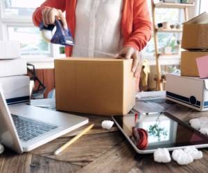 Business Start up SME concept. Young startup entrepreneur small business owner working at home, packaging and delivery situation.
