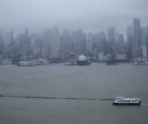 WEEHAWKEN, NJ - MARCH 07: A NY Waterway ferry sails on the Hudson River as the winter storm Quinn approaches New York City on March 7, 2018 in Weehawken, New Jersey. This is the second nor'easter to hit the area within a week and is expected to bring heavy snowfall and winds, raising fears of another round of electrical outages. Kena Betancur/Getty Images/AFP