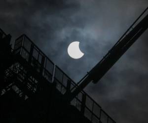 <i>A general view showing a partial solar eclipse in Jakarta on April 20, 2023. (Photo by BAY ISMOYO / AFP)</i>