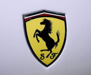 A Ferrari logo is pictured during the Tokyo Auto Salon in Tokyo on January 12, 2020. (Photo by CHARLY TRIBALLEAU / AFP)