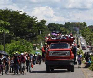 Honduran migrants take part in a caravan heading to the US, in the outskirts of Tapachula, on their way to Huixtla, Chiapas state, Mexico, on October 22, 2018. - President Donald Trump on Monday called the migrant caravan heading toward the US-Mexico border a national emergency, saying he has alerted the US border patrol and military. (Photo by Johan ORDONEZ / AFP)