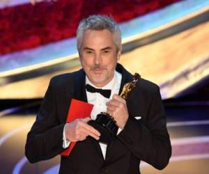 Best Foreign Language Film nominee for 'Roma' Mexican director Alfonso Cuaron accepts the award for Best Foreign Language Film during the 91st Annual Academy Awards at the Dolby Theatre in Hollywood, California on February 24, 2019. (Photo by VALERIE MACON / AFP)