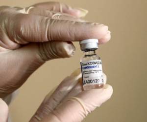 A nurse administers a dose of the Moderna Covid-19 vaccine at a clinic for Catholic school education workers including elementary school teachers and staff at a vaccination site at Loyola Marymount University (LMU) on March 8, 2021 in Los Angeles, California. (Photo by Patrick T. FALLON / AFP)