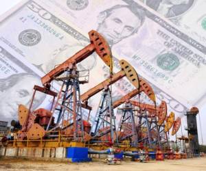 Petroleum, petrodollar and crude oil concept, Oil pump on background of US dollar, Dollars and oil pumps