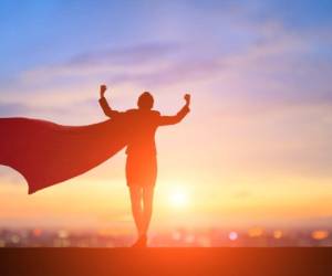 silhouette of super business woman feel strong with sunset