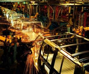 A sign is viewed at the General Motors Detroit-Hamtramck Assembly as they announced the closing of multiple facilities including this one on November 26, 2018 in Detroit, Michigan. - In a massive restructuring, US auto giant General Motors announced Monday it would cut 15 percent of its workforce to save $6 billion and adapt to 'changing market conditions.'The moves include shuttering seven plants worldwide as the company responds to changing customer preferences and focuses on popular trucks and SUVs and increasingly on electric models.GM will shutter three North American auto assembly plants next year: the Oshawa plan in Ontario, Canada; Hamtramck in Detroit, Michigan and Lordstown in Warren, Ohio.In addition, it will close propulsion plants -- which produce batteries and transmissions -- in Baltimore, Maryland and Warren, Michigan, as well two more unidentified plants outside of North America. (Photo by JEFF KOWALSKY / AFP)