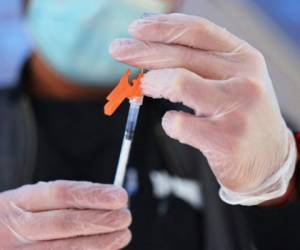 NEW YORK, NEW YORK - OCTOBER 21: A VIP StarNETWORK medical staff member prepares a Pfizer-BioNTech coronavirus (COVID-19) vaccine at a #VAXTOSCHOOL pop-up site at Life of Hope Center on October 21, 2021 in New York City. Gov. Kathy Hochul announced yesterday the opening of 25 new coronavirus (COVID-19) vaccination pop-up sites in an initiative to help increase vaccination rates among school-aged New Yorkers. The Department of Health is working alongside local county health departments, community-based organizations, and healthcare centers to install these sites in different regions of the state. According to the state COVID-19 vaccine tracker, since October 18, 62 percent of 12 to 15-year-olds and 72 percent of 16 to 25-year-olds have received at least one coronavirus vaccine dose. Michael M. Santiago/Getty Images/AFP (Photo by Michael M. Santiago / GETTY IMAGES NORTH AMERICA / Getty Images via AFP)