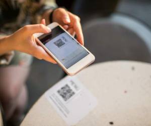 woman scanning qr code for online menu