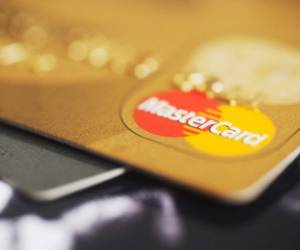 'Cape Town, South Africa - May 18, 2012: A closeup of a gold credit card with the MasterCard logo visible.'