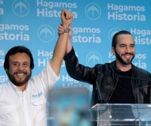 El Salvador presidential candidate Nayib Bukele of the Great National Alliance (GANA) (R) and vice presidential candidate Felix Ulloa celebrate their victory in the presidential election in San Salvador on February 3, 2019. - Nayib Bukele, the popular former mayor of San Salvador, claimed victory on February 3 in the Central American country's presidential elections. (Photo by MARVIN RECINOS / AFP)