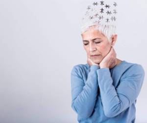 Memory loss due to dementia. Senior woman losing parts of head as symbol of decreased mind function. Senior woman losing parts of head feeling confused as symbol of decreased mind function.