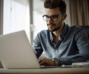 Young businessman working on laptop