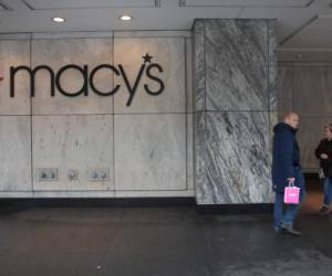 CHICAGO, ILLINOIS - NOVEMBER 21: Pedestrians walk past a Macy's store downtown on November 21, 2019 in Chicago, Illinois. Macys Inc. reported a drop in third quarter sales and said the company is anticipating a weak holiday quarter as they, like other department stores, struggle to continue to attract customers. Scott Olson/Getty Images/AFP