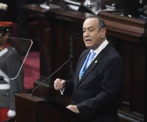 Guatemalan President Alejandro Giammattei speaks while presenting the official report of his second year in power before the Congress, in Guatemala City on January 14, 2022. (Photo by Johan ORDONEZ / AFP)