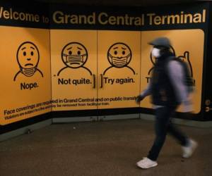 NEW YORK, NEW YORK - OCTOBER 21: A display at Grand Central Terminal shows how to wear a face mask on October 21, 2020 in New York City. Recent data from John Hopkins University shows that the U.S. recorded 60,315 positive COVID-19 cases across the United States on Tuesday. The U.S. has recorded at least 220,000 COVID-19 deaths, the highest death toll in the world. Spencer Platt/Getty Images/AFP