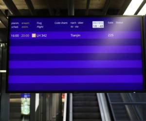 A screen showing Lufthansa flight LH 342 to Tianjin, China (the first post-lockdown flight departing Europe for China) is pictured at the airport in Frankfurt am Main, western Germany, on May 29, 2020. - A first mass flight carrying Europeans to China following weeks of lockdown departed Germany's biggest hub Frankfurt late Friday, carrying around 200 workers and their families (Photo by Yann Schreiber / AFP)