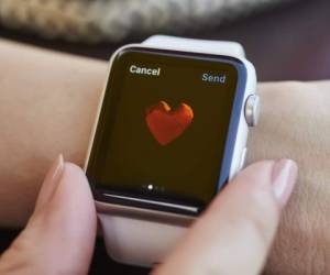 Istanbul, Turkey - September 6, 2015: A woman wearing 42mm stainless steel Apple Watch with white sports band. The Apple Watch became available April 24, 2015, bringing a new way to receive information at a glance, using apps designed specifically for the wrist.