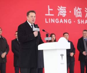 Tesla CEO Elon Musk gestures during the Tesla China-made Model 3 Delivery Ceremony in Shanghai. - Tesla CEO Elon Musk presented the first batch of made-in-China cars to ordinary buyers on January 7, 2020 in a milestone for the company's new Shanghai 'giga-factory', but which comes as sales decelerate in the world's largest electric-vehicle market. (Photo by STR / AFP) / China OUT