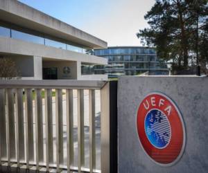 A picture taken in Nyon on March 17, 2020 shows the gate at the headquarters of UEFA, the European football's governing body, amid spread of novel coronavirus (COVID-19). - UEFA has proposed postponing the European Championship, due to take place across the continent in June and July this year, until 2021 at crisis meetings on Tuesday, a source close to European football's governing body told AFP. (Photo by FABRICE COFFRINI / AFP)