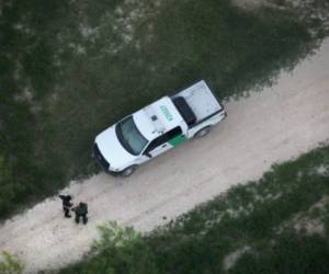 LA GRULLA, TX - MARCH 15: A U.S border agent detains an undocumented immigrant near the U.S.-Mexico border on March 15, 2017 near La Grulla, Texas. U.S. Customs and Border Protection announced that illegal crossings along the southwest border with Mexico dropped 40 percent during the month of February. John Moore/Getty Images/AFP