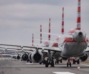 PITTSBURGH, PA - MARCH 27: Jets are parked on runway 28 at the Pittsburgh International Airport on March 27, 2020 in Pittsburgh, Pennsylvania. Due to decreased flights as a result of the coronavirus (COVID-19) pandemic, close to 70 American Airlines planes are being stacked and parked at the airport. Jeff Swensen/Getty Images/AFP