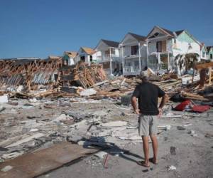 MEXICO BEACH, FL - OCTOBER 19: James Whiddon looks over damage caused by Hurricane Michael on October 19, 2018 in Mexico Beach, Florida. Hurricane Michael slammed into the Florida Panhandle on October 10, as a category 4 storm causing massive damage and claiming over 30 lives. Scott Olson/Getty Images/AFP