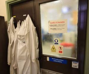 A drop-off point to receive samples of the novel coronavirus COVID-19 for testing is seen at the entrance to the pathology laboratories at the Old Medical School, Leeds General Infirmary during a visit by Britain's Chancellor of the Exchequer Rishi Sunak to highlight the record infrastructure spend after yesterday's budget, in Leeds, Yorkshire on March 12, 2020. (Photo by Danny Lawson / POOL / AFP)