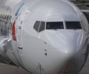 MIAMI, FL - MARCH 13: An American Airlines Boeing 737 Max 8 pulls into its gate after arriving at the Miami International Airport from Saint Thomas on March 13, 2019 in Miami, Florida. American Airlines is reported to say that it will ground its fleet of 24 Boeing 737 Max planes and it plans to rebook passengers after the Federal Aviation Administration grounded the entire United States Boeing 737 MAX fleet. Joe Raedle/Getty Images/AFP