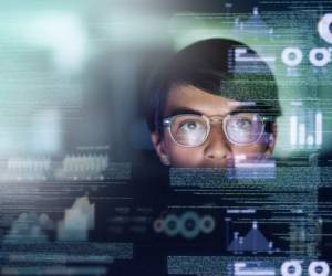 Cropped shot of a young computer programmer looking through data