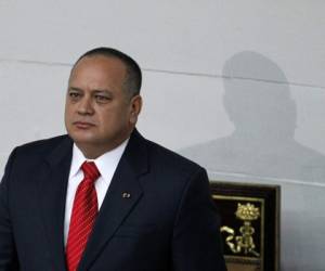 Diosdado Cabello, center, a member of the Constitutional Assembly and chief of the ruling party, attends a parade marking the anniversary of the 1992 failed coup led by late President Hugo Chavez in Caracas, Venezuela, Sunday, Feb. 4, 2018. (AP Photo/Ariana Cubillos)