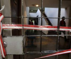 View of the entrance to building of the NGO Center of Investigation on Communication (CINCO) after it was raided in Managua on December 14, 2018. - The Nicaraguan police raided Friday the offices of Human Rights organizations and other associations as actions against the opponents to the government of Daniel Ortega intensify, the affected denounced. Several NGOs were stripped of their legal status by the National Assembly. (Photo by Inti Ocon / AFP)