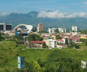 San Jose, Costa Rica - June 18, 2012: View to the National Stadium and buildings with mountains at the background in San Jose, Costa Rica.