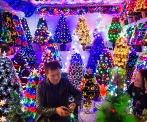 November 27, 2015, Yiwu China - A stall featuring Christmas trees in the Festival Arts section of Arts of Crafts inside the Yiwu International Trade Market. Yiwu International Trade Market is the world's largest whole sale market for small commodities. These plastic trees are made locally at the Sinte An factory.