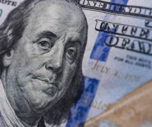 Benjamin Franklin on a 100 US dollars bill. Concept of recession and worldwide economic crisis.