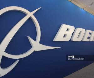 (FILES) In this file photo taken on June 19, 2019 a Boeing Logo is seen in one of the Boeing's stands at the International Paris Air Show at Le Bourget Airport, near Paris. - Boeing has reached settlements with 11 families of victims from October's Lion Air crash, the first agreements following two deadly crashes that killed 346 people, a plaintiffs attorney said September 25, 2019. The Wisner Law Firm, which specializes in aviation cases, is also 'optimistic' about reaching settlements on its remaining six cases for families affected by the crash in Indonesia, said attorney Alexandra Wisner. (Photo by ERIC PIERMONT / AFP)